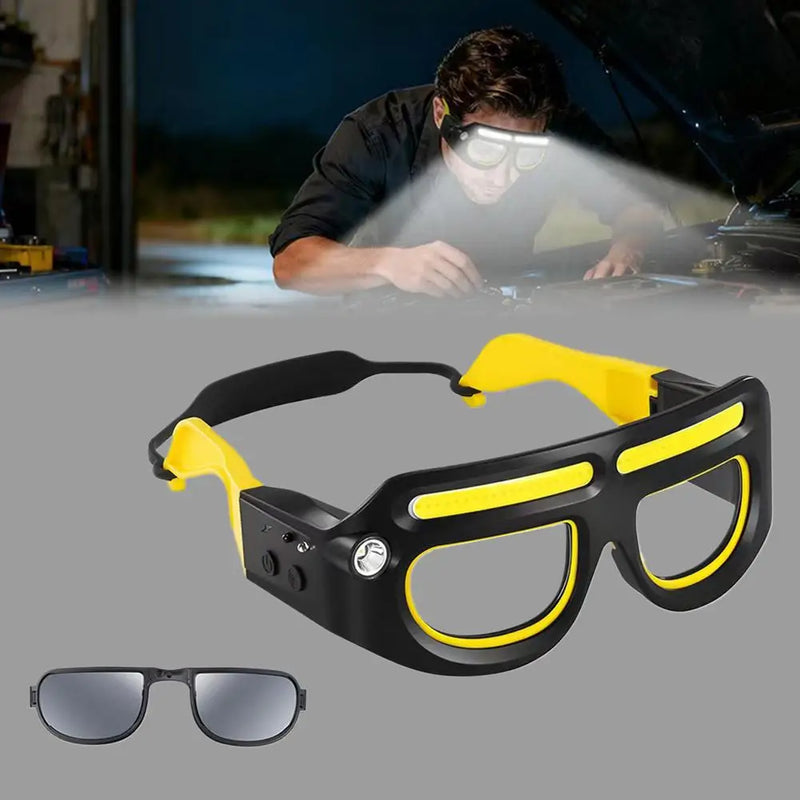 A mechanic working under a car hood at night by the light of the glasses, with the frame and its clip-on shade lens below