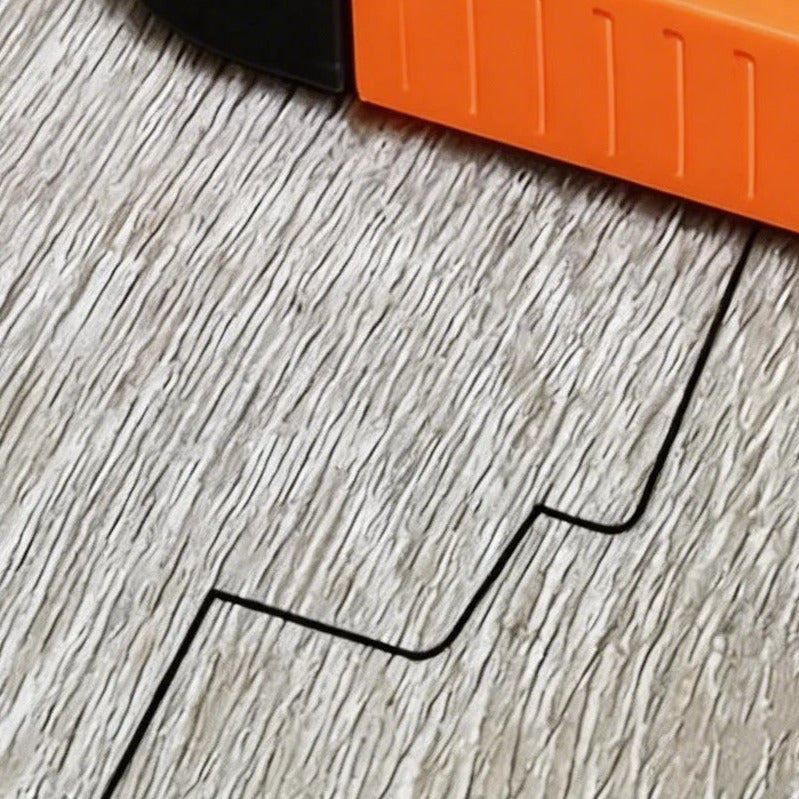 The stepped pencil line the tool has drawn on the floor plank