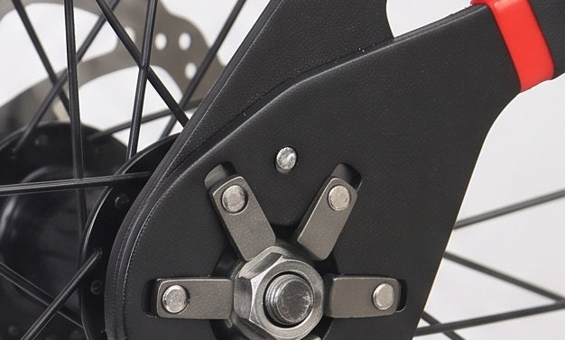 The wrench on a bicycle wheel hub nut