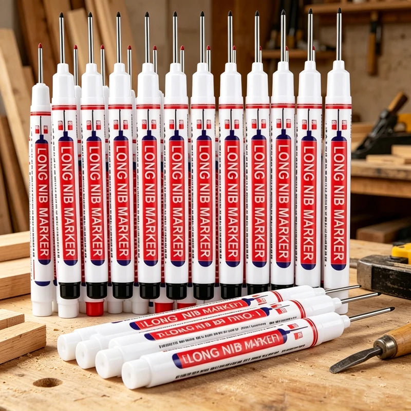 A row of long nib markers standing on a carpenter's workbench