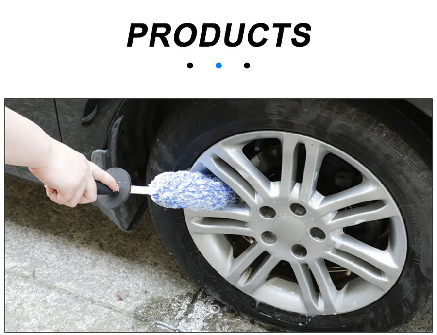 The blue wheel brush held against the spokes of an alloy wheel