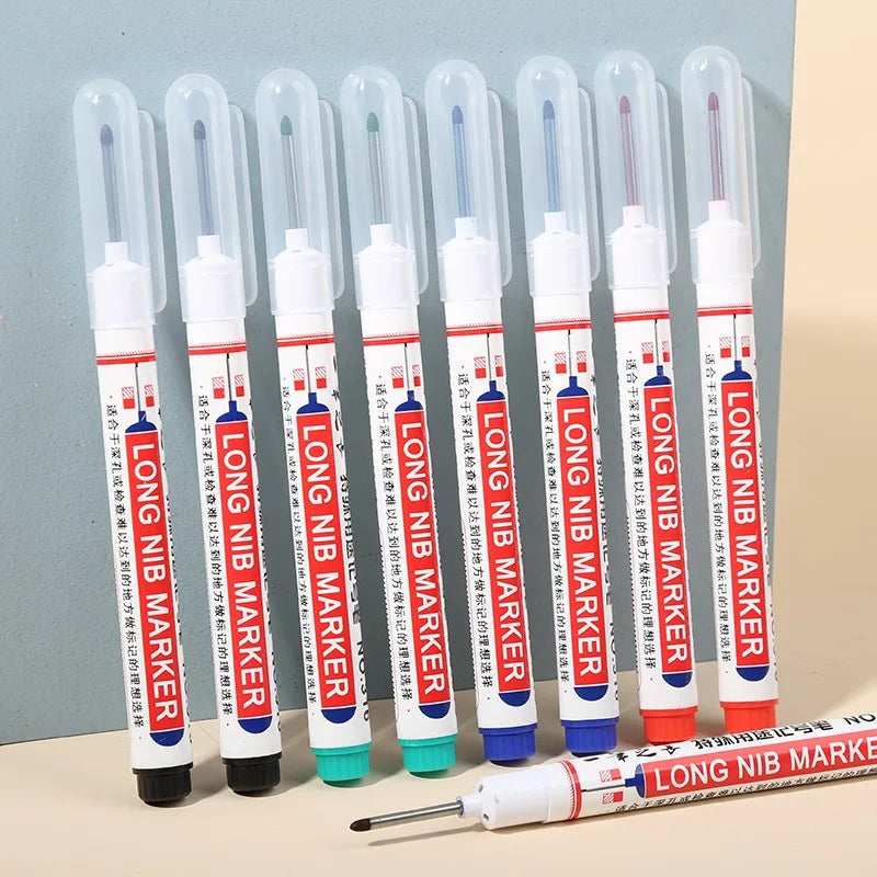 Long nib markers with their clear caps on, in black, red, blue, green and white
