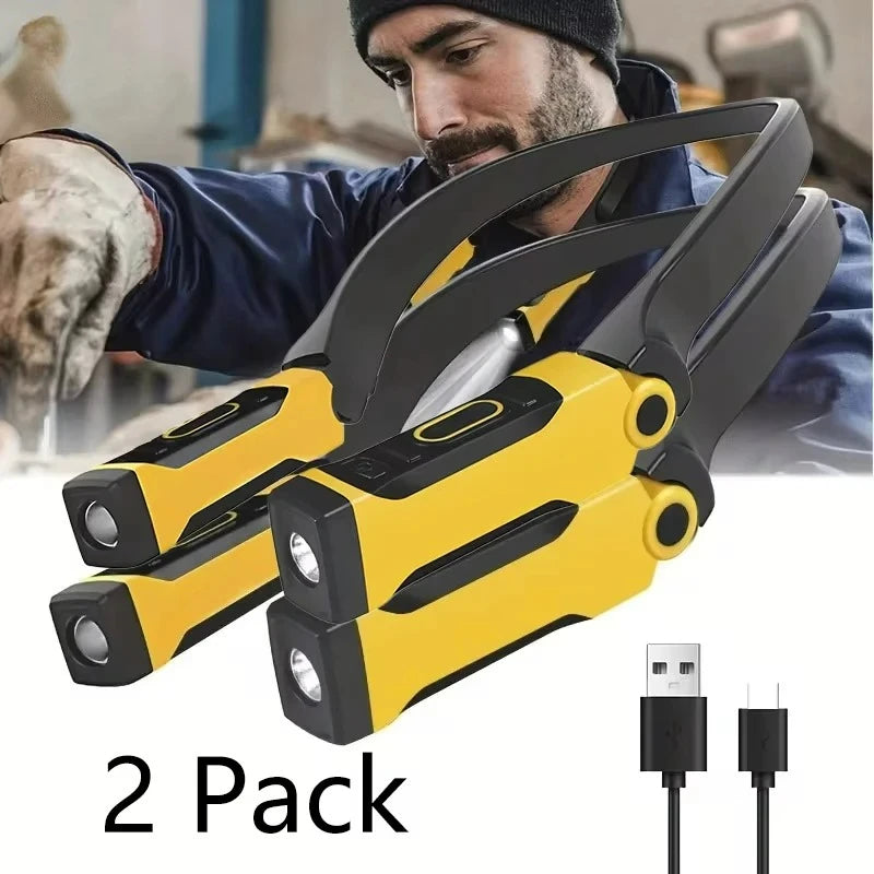 The two-light pack worn under a car: the collar sits on the chest and both heads aim at the work