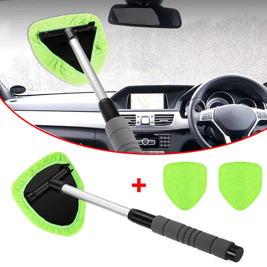 The green cleaner held against the inside of a windscreen, shown with its two spare pads