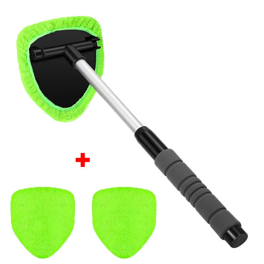 The green set on white: the tool with a pad fitted, plus two spare pads