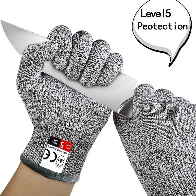 Gloved hand gripping a knife blade, with the maker's level 5 caption