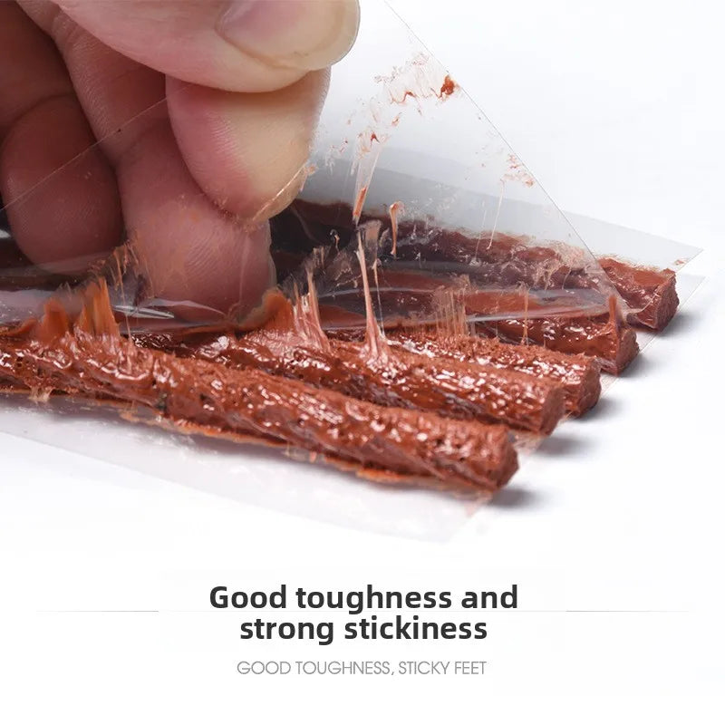 Close-up of the rubber strips stretching, showing how soft and tacky they are