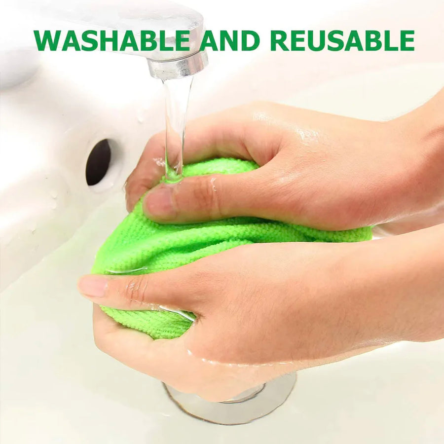 A microfiber pad being rinsed by hand under a tap