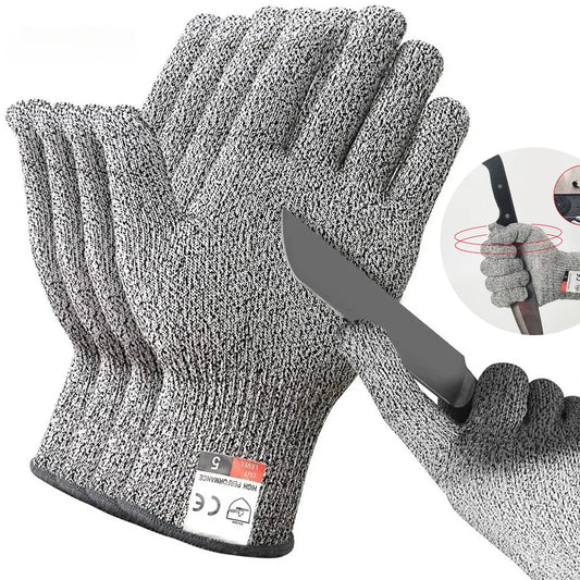 Gray HPPE cut-resistant gloves stacked to show the cut level 5 cuff tag, beside a gloved hand holding a knife blade