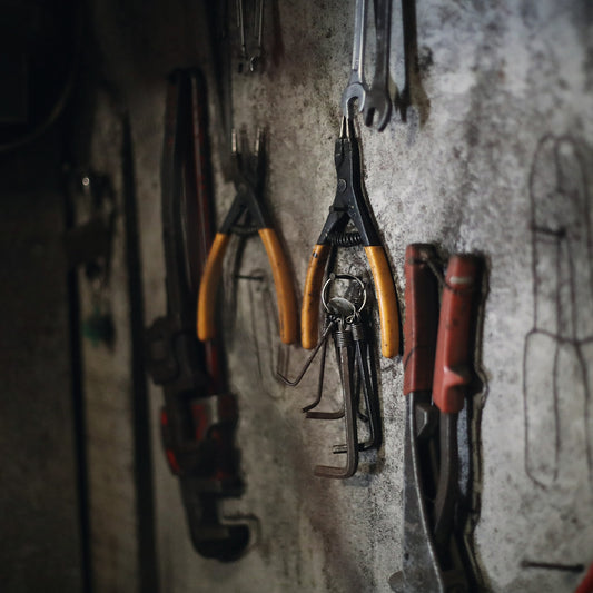 Pliers hanging on a workshop wall