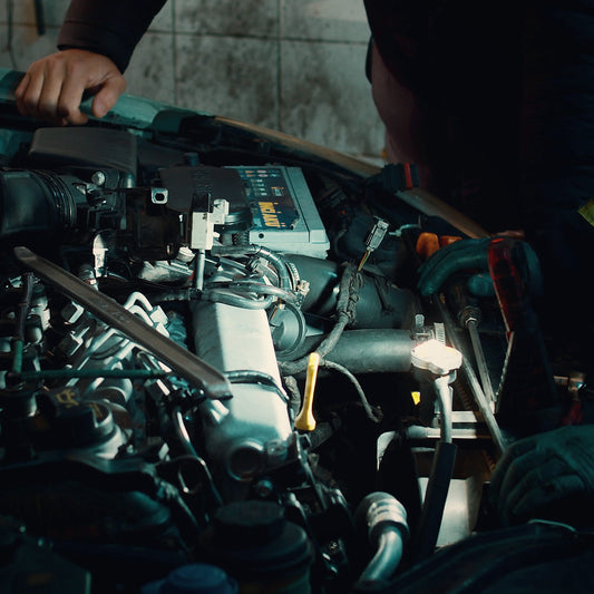 Work light shining into a dark engine bay