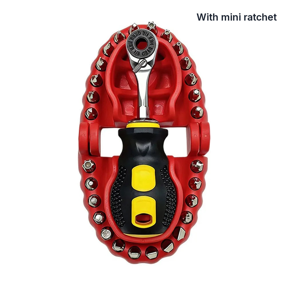The kit with the mini ratchet, seen from above: case open, 28 bits around the rim, the ratchet in the upper jaw and the stubby handle in the lower jaw