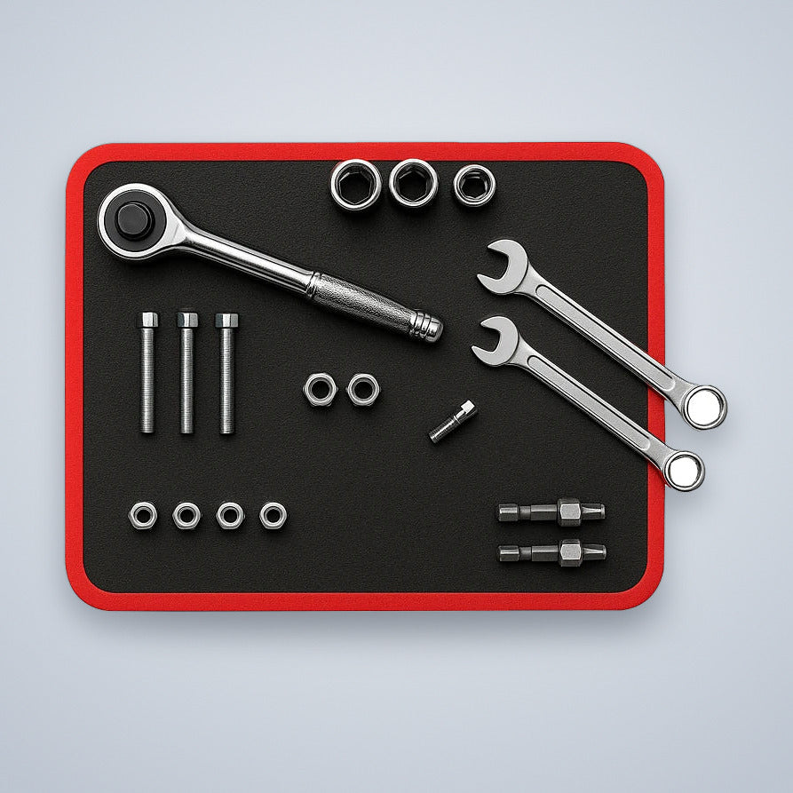 Magnetic tool mat holding a ratchet, wrenches, sockets and bolts