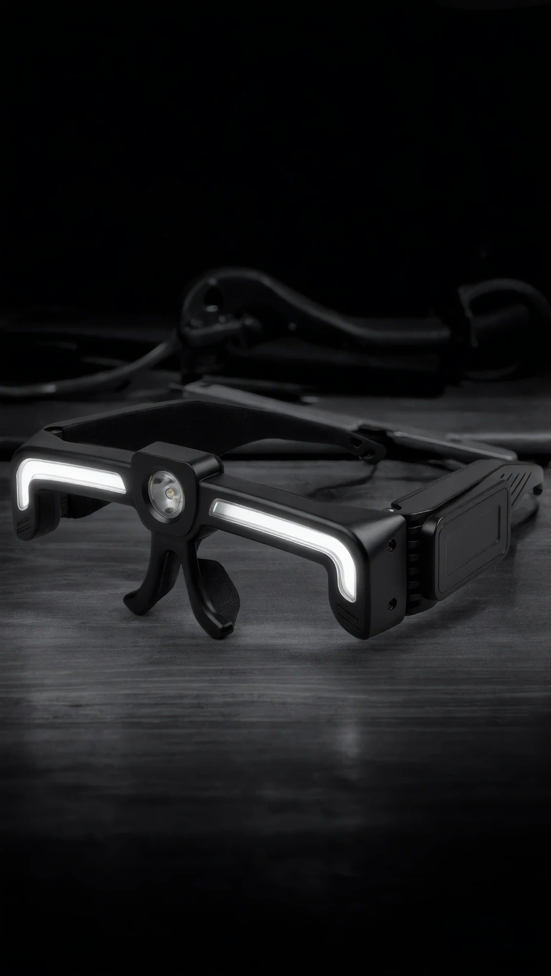 The glasses light on a dark workbench with both COB strips lit