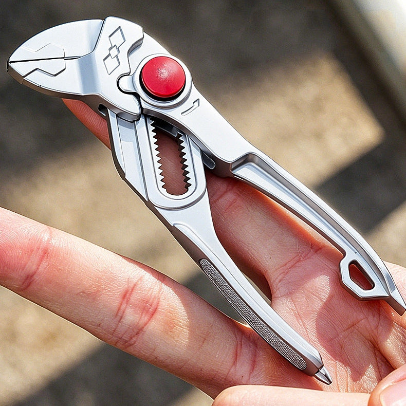 The silver pliers lying across an open palm