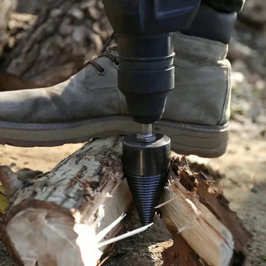 Holding a log with one foot while the cone splits it