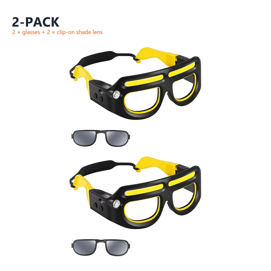 Two pairs of the LED safety glasses, each with its clip-on shade lens